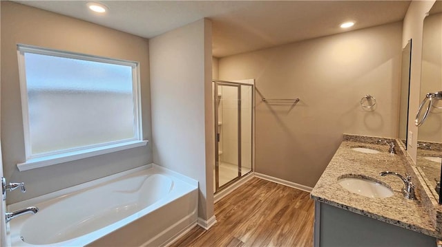 5189 Pinyon Dr, Mobile, AL 36693 - full bathroom featuring a garden tub, wood finished floors, a sink, and a shower stall