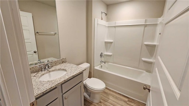 5189 Pinyon Dr, Mobile, AL 36693 - bathroom featuring shower / bath combination, wood finished floors, toilet, and vanity