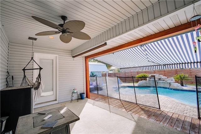 view of pool featuring pool water feature and a patio