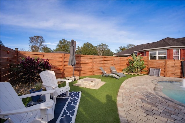 view of yard with a fenced in pool and a patio