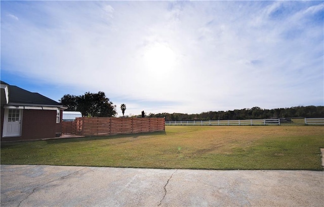 view of yard with a rural view