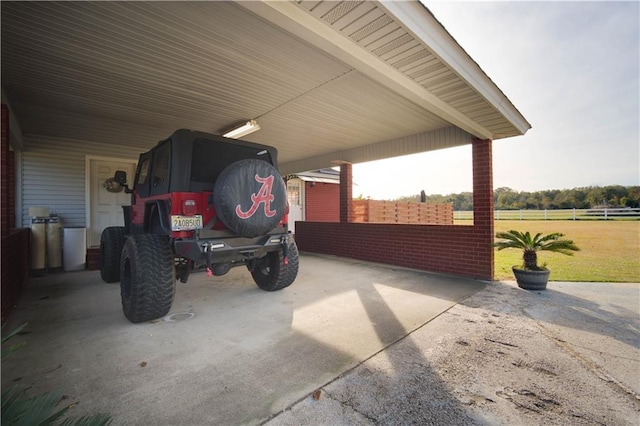 view of parking / parking lot featuring a carport