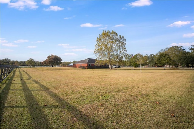 view of yard with a rural view