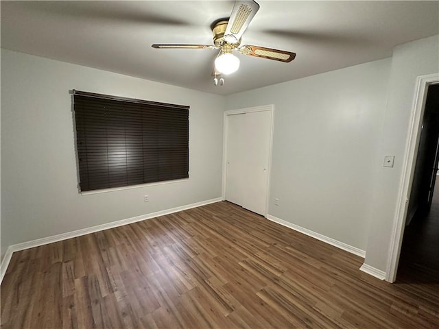 5859 Chalet Dr N, Mobile, AL 36608 - unfurnished bedroom with dark wood finished floors and a ceiling fan