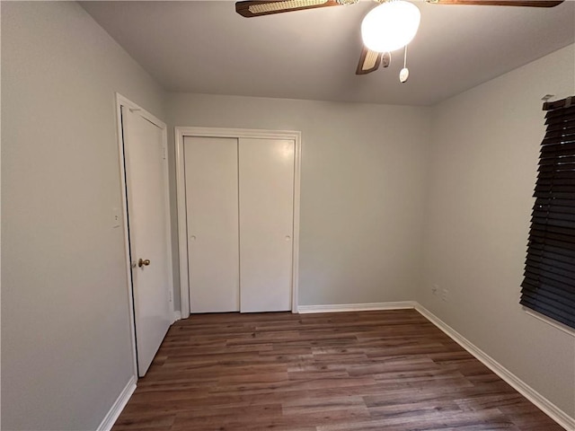 5859 Chalet Dr N, Mobile, AL 36608 - unfurnished bedroom with wood finished floors, ceiling fan, and a closet