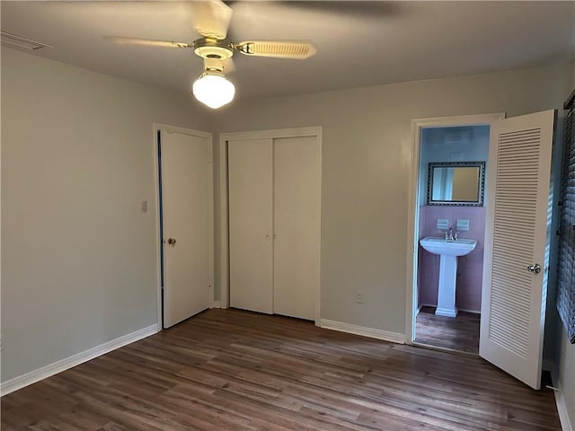 5859 Chalet Dr N, Mobile, AL 36608 - unfurnished bedroom featuring wood finished floors, ensuite bath, a closet, and ceiling fan