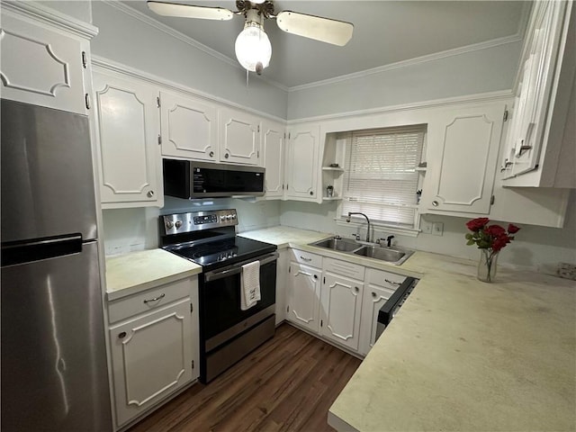5859 Chalet Dr N, Mobile, AL 36608 - kitchen featuring appliances with stainless steel finishes, white cabinets, a ceiling fan, crown molding, and light countertops