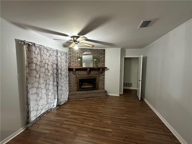 5859 Chalet Dr N, Mobile, AL 36608 - unfurnished living room featuring a ceiling fan, a brick fireplace, wood finished floors, and ornamental molding
