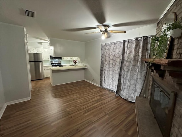 5859 Chalet Dr N, Mobile, AL 36608 - living room featuring dark wood-type flooring, ceiling fan, and a fireplace