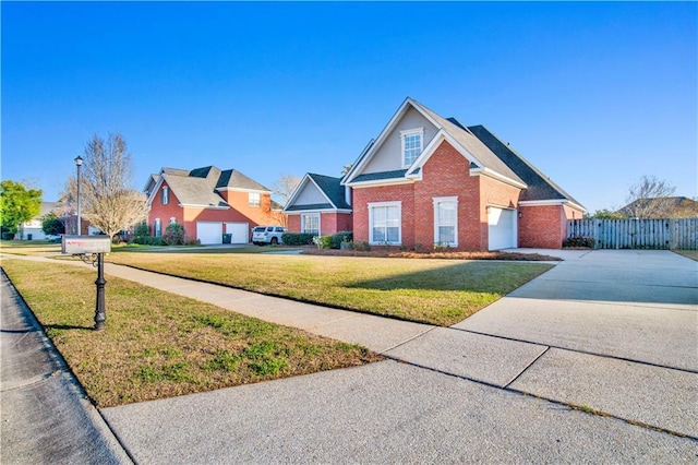 view of front of home with fence, a front lawn, concrete driveway, and brick siding