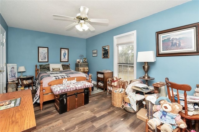 bedroom with ceiling fan and wood finished floors