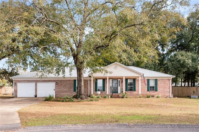 ranch-style house with brick siding, crawl space, fence, a garage, and driveway