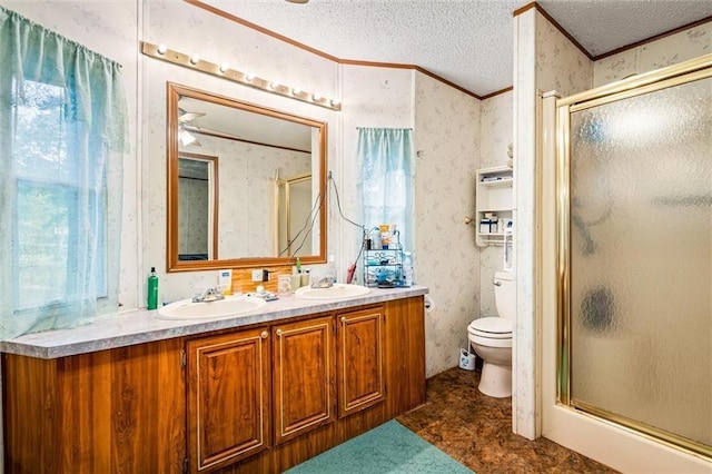 bathroom with ceiling fan, a shower with door, vanity, and toilet