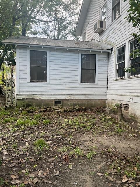 view of side of home with cooling unit