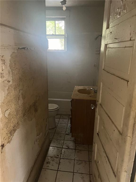 full bathroom with tile patterned floors, vanity,  shower combination, and toilet