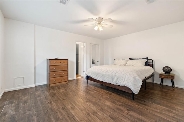 bedroom with ceiling fan and dark wood-type flooring