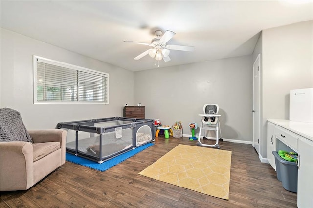 bedroom with ceiling fan and dark hardwood / wood-style floors