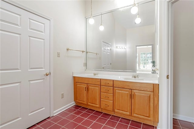 bathroom with double sink vanity and tile patterned floors