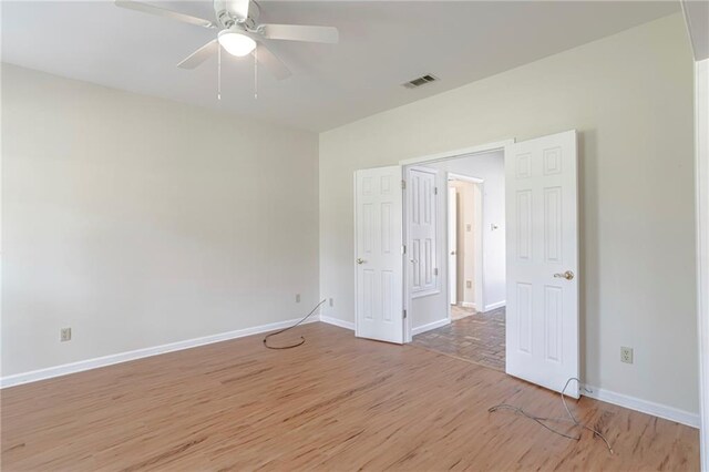 unfurnished bedroom featuring ceiling fan and wood-type flooring