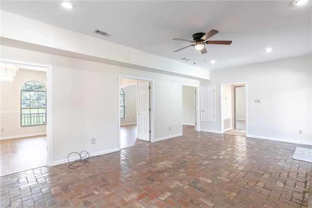 unfurnished room featuring hardwood / wood-style floors and ceiling fan