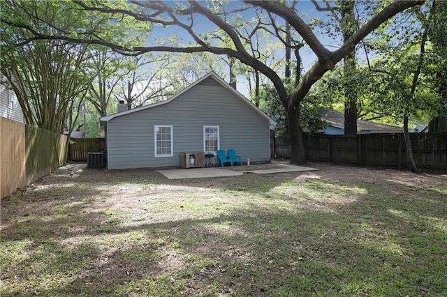 exterior space featuring a patio, central AC unit, and a lawn