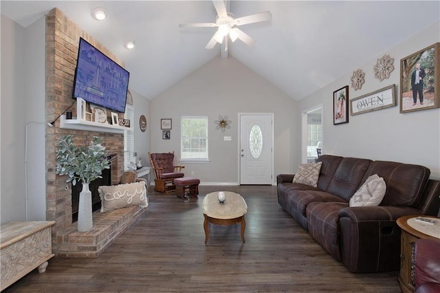 living room with ceiling fan, a fireplace, dark hardwood / wood-style floors, and high vaulted ceiling