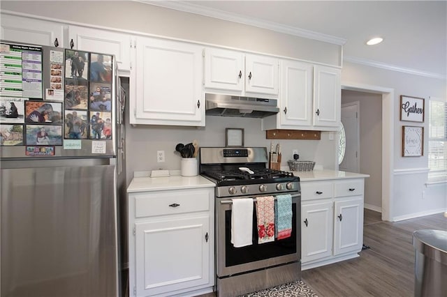 kitchen featuring white cabinetry, ornamental molding, stainless steel appliances, and wood-type flooring