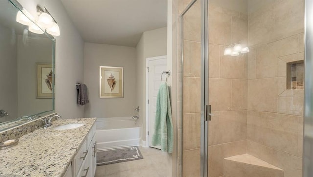 10580 Relic Rd S, Mobile, AL 36608 - bathroom featuring vanity, a garden tub, a shower stall, and tile patterned floors