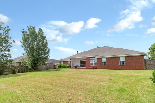 9633 White Castle Rd, Mobile, AL 36695 - back of house with a fenced backyard and brick siding
