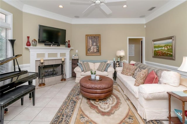 9633 White Castle Rd, Mobile, AL 36695 - living area with ornamental molding, light tile patterned flooring, ceiling fan, a tile fireplace, and recessed lighting