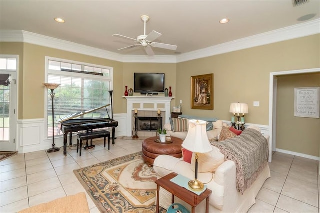 9633 White Castle Rd, Mobile, AL 36695 - living area featuring light tile patterned flooring, a ceiling fan, wainscoting, plenty of natural light, and ornamental molding