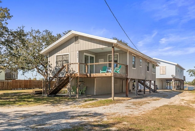 back of house with a carport