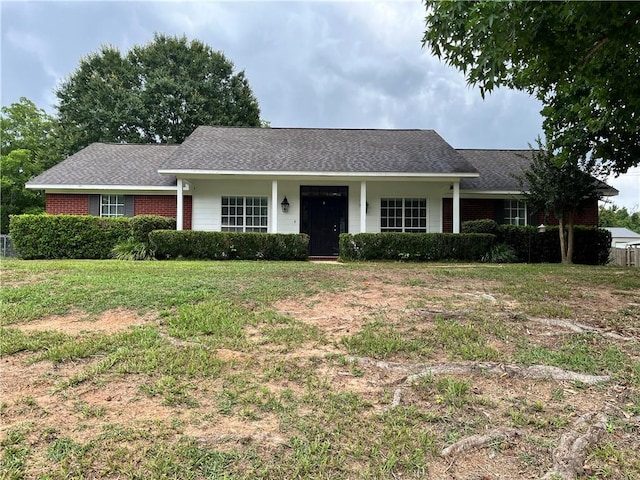 3435 Plantation Ct, Mobile, AL 36695 - ranch-style house with brick siding, a front yard, and roof with shingles