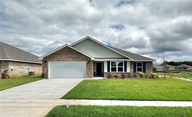 craftsman-style home with central air condition unit, a front yard, and a garage