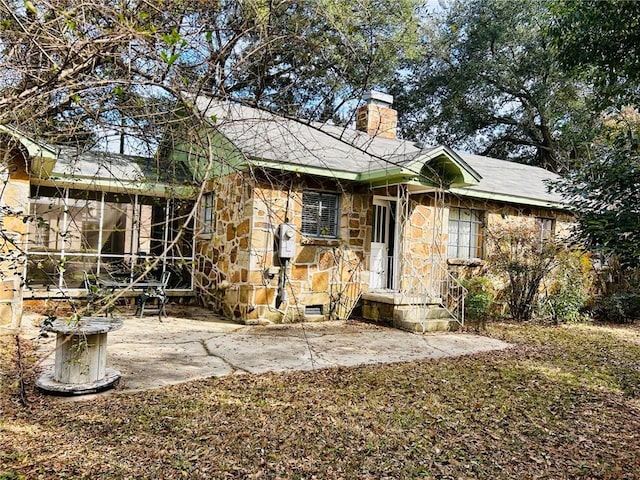 rear view of house with a patio area