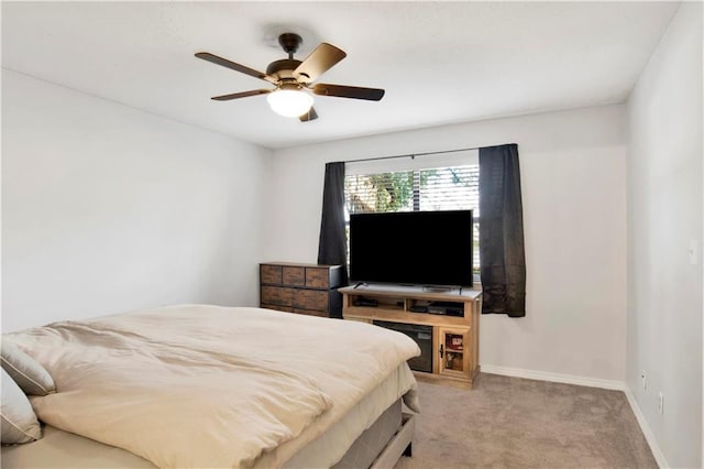 bedroom featuring light carpet and ceiling fan