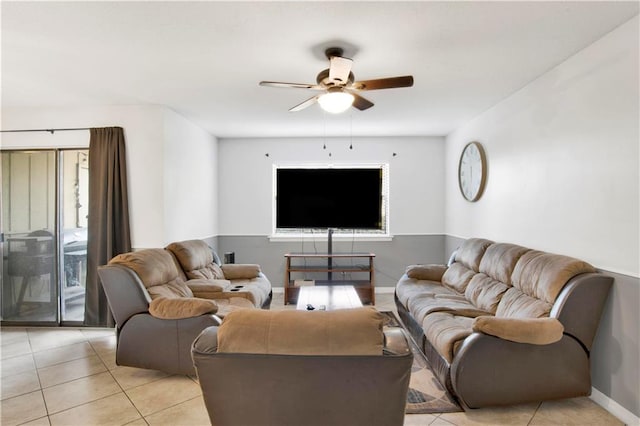 living room with plenty of natural light, light tile patterned floors, and ceiling fan