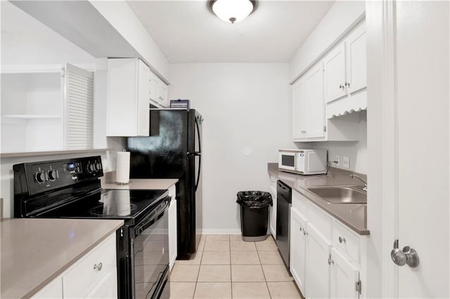 kitchen featuring light tile patterned floors, sink, dishwasher, white cabinets, and black range with electric cooktop