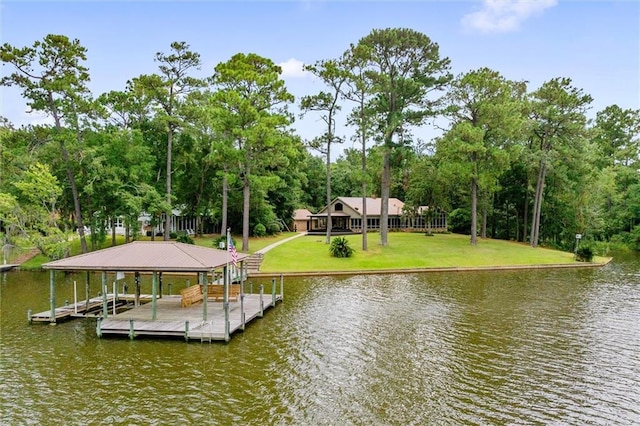 dock area with a water view and a yard