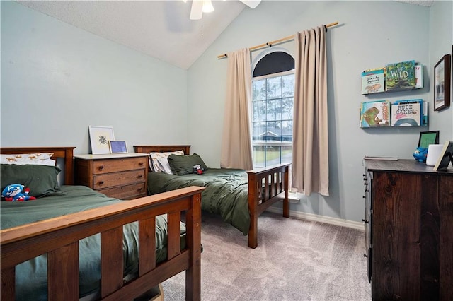 carpeted bedroom with baseboards, lofted ceiling, and ceiling fan