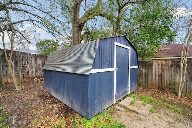 view of shed with a fenced backyard