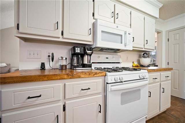 kitchen featuring crown molding, butcher block countertops, white cabinets, white appliances, and a textured ceiling