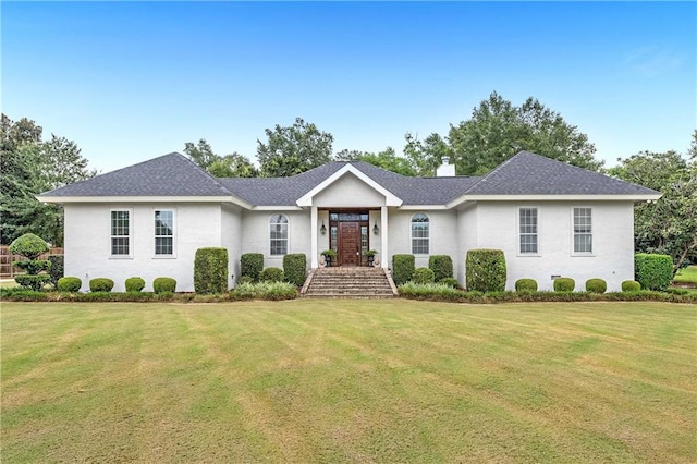 ranch-style house featuring a front lawn