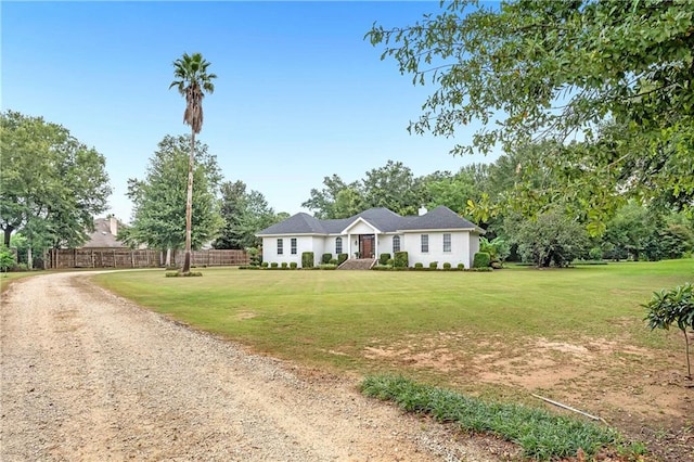 single story home featuring a front lawn