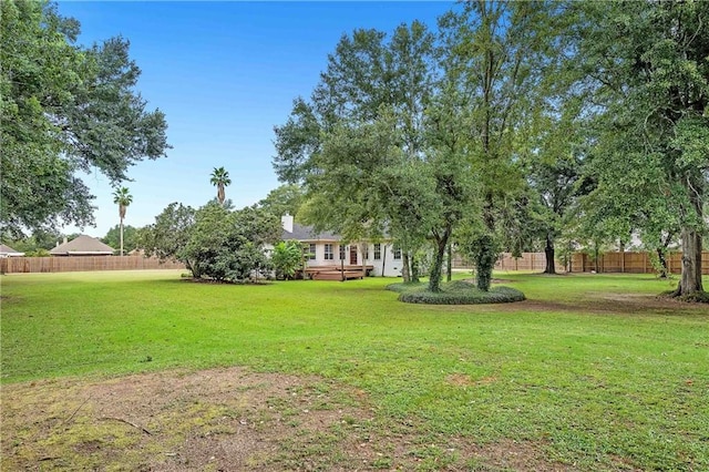 view of yard with a wooden deck