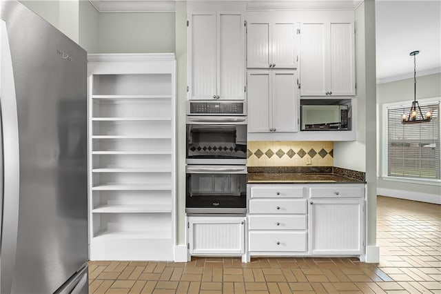 kitchen with stainless steel appliances, decorative backsplash, ornamental molding, and white cabinetry