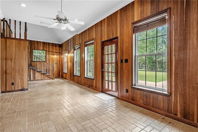 interior space featuring wood walls and plenty of natural light