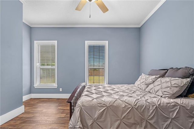 bedroom with ceiling fan, crown molding, and wood-type flooring