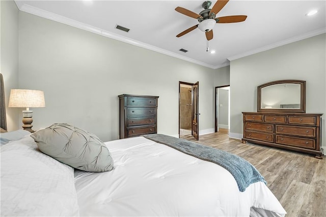 bedroom with light hardwood / wood-style flooring, ceiling fan, and crown molding