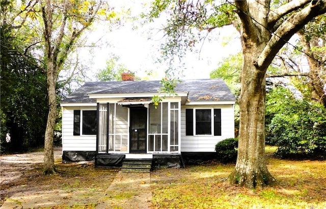 view of front facade featuring a sunroom